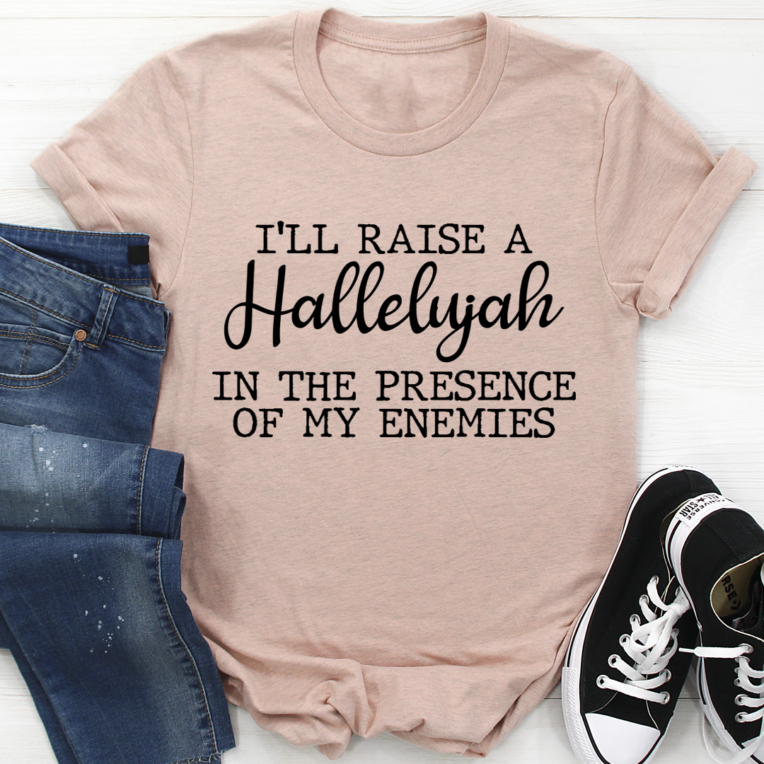 A black t-shirt featuring the phrase 'I'll Raise A Halleluyah In The Presence Of My Enemies' in stylish typography, made from soft cotton.